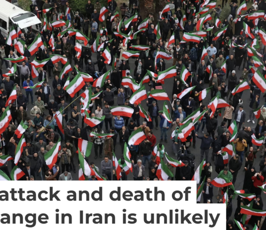 A group of demonstrators in Tehran wave Iranian flags in support of the government on Feb. 28, 2026. AP Photo/Vahid Salemi